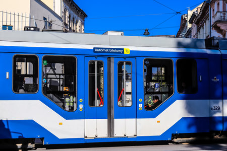 Krakow, Poland - October 08, 2022 Modern electric tram driving in the streets of Krakow and part of the transport system of the city, the fares are not expensiveのeditorial素材