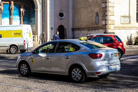 Krakow, Poland - October 08, 2022 Taxi driving in the streets of Krakow and part of the transport system of the city, several taxi companies compete for this activity and the fares are not expensiveのeditorial素材