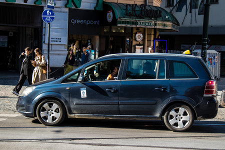 Krakow, Poland - October 08, 2022 Taxi driving in the streets of Krakow and part of the transport system of the city, several taxi companies compete for this activity and the fares are not expensiveのeditorial素材