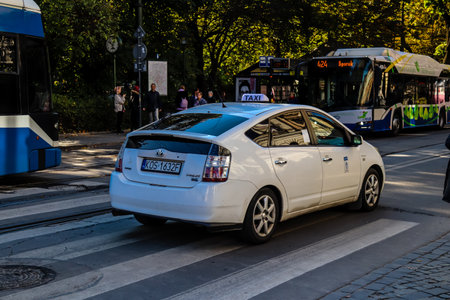 Krakow, Poland - October 08, 2022 Taxi driving in the streets of Krakow and part of the transport system of the city, several taxi companies compete for this activity and the fares are not expensiveのeditorial素材