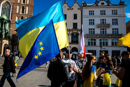 Krakow, Poland - October 08, 2022 Demonstration of Ukrainian people at Rynek GÅowny Square against the invasion of Russia, Poland hosts a large number of refugees due to the proximity of the countryのeditorial素材