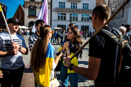 Krakow, Poland - October 08, 2022 Demonstration of Ukrainian people at Rynek GÅowny Square against the invasion of Russia, Poland hosts a large number of refugees due to the proximity of the countryのeditorial素材