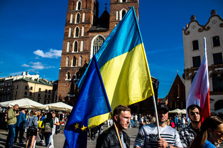 Krakow, Poland - October 08, 2022 Demonstration of Ukrainian people at Rynek GÅowny Square against the invasion of Russia, Poland hosts a large number of refugees due to the proximity of the countryのeditorial素材