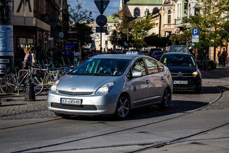 Krakow, Poland - October 08, 2022 Taxi driving in the streets of Krakow and part of the transport system of the city, several taxi companies compete for this activity and the fares are not expensiveのeditorial素材