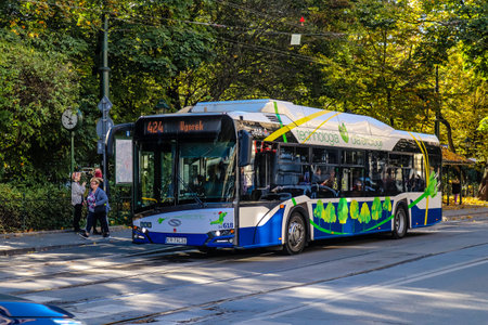 Krakow, Poland - October 08, 2022 Bus driving in the streets of Krakow and part of the transport system of the city, the fares are not expensiveのeditorial素材