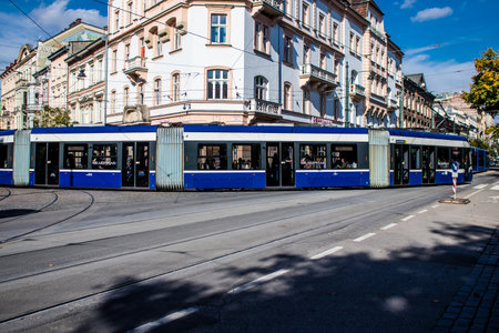 Krakow, Poland - October 08, 2022 Modern electric tram driving in the streets of Krakow and part of the transport system of the city, the fares are not expensiveのeditorial素材
