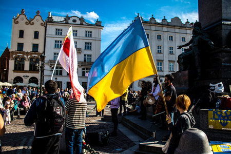 Krakow, Poland - October 08, 2022 Demonstration of Ukrainian people at Rynek GÅowny Square against the invasion of Russia, Poland hosts a large number of refugees due to the proximity of the countryのeditorial素材