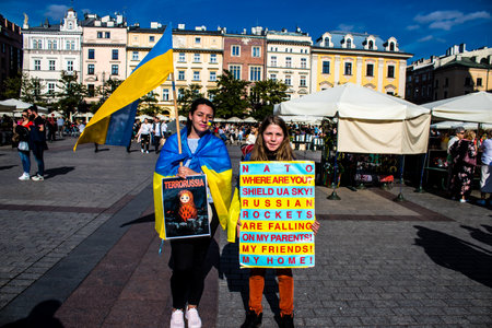 Krakow, Poland - October 08, 2022 Demonstration of Ukrainian people at Rynek GÅowny Square against the invasion of Russia, Poland hosts a large number of refugees due to the proximity of the countryのeditorial素材