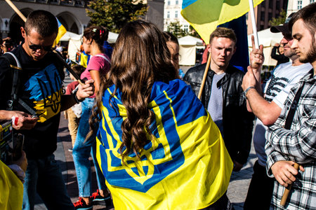 Krakow, Poland - October 08, 2022 Demonstration of Ukrainian people at Rynek GÅowny Square against the invasion of Russia, Poland hosts a large number of refugees due to the proximity of the countryのeditorial素材