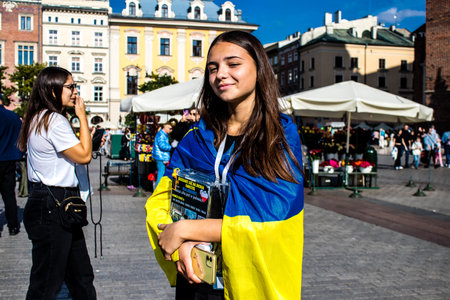 Krakow, Poland - October 08, 2022 Demonstration of Ukrainian people at Rynek GÅowny Square against the invasion of Russia, Poland hosts a large number of refugees due to the proximity of the countryのeditorial素材