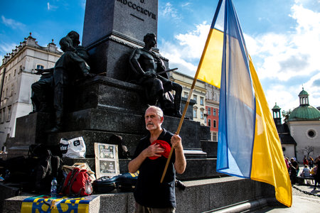 Krakow, Poland - October 08, 2022 Demonstration of Ukrainian people at Rynek GÅowny Square against the invasion of Russia, Poland hosts a large number of refugees due to the proximity of the countryのeditorial素材