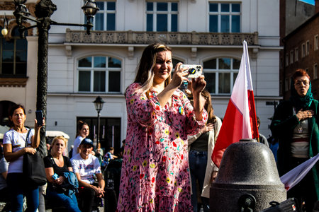 Krakow, Poland - October 08, 2022 Demonstration of Ukrainian people at Rynek GÅowny Square against the invasion of Russia, Poland hosts a large number of refugees due to the proximity of the countryのeditorial素材