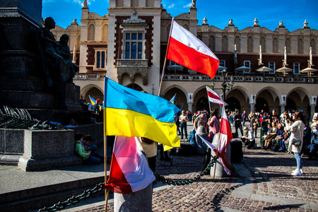 Krakow, Poland - October 08, 2022 Demonstration of Ukrainian people at Rynek GÅowny Square against the invasion of Russia, Poland hosts a large number of refugees due to the proximity of the countryのeditorial素材