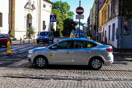 Krakow, Poland - October 08, 2022 Taxi driving in the streets of Krakow and part of the transport system of the city, several taxi companies compete for this activity and the fares are not expensiveのeditorial素材