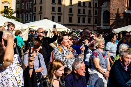 Krakow, Poland - October 08, 2022 Demonstration of Ukrainian people at Rynek GÅowny Square against the invasion of Russia, Poland hosts a large number of refugees due to the proximity of the countryのeditorial素材