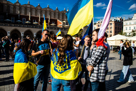 Krakow, Poland - October 08, 2022 Demonstration of Ukrainian people at Rynek GÅowny Square against the invasion of Russia, Poland hosts a large number of refugees due to the proximity of the countryのeditorial素材
