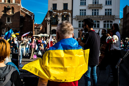 Krakow, Poland - October 08, 2022 Demonstration of Ukrainian people at Rynek GÅowny Square against the invasion of Russia, Poland hosts a large number of refugees due to the proximity of the countryのeditorial素材