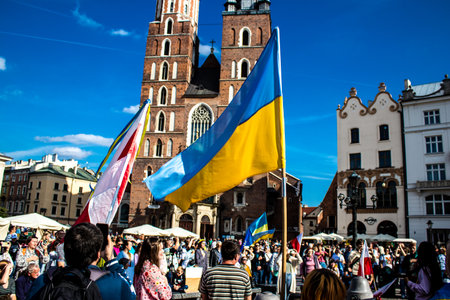 Krakow, Poland - October 08, 2022 Demonstration of Ukrainian people at Rynek GÅowny Square against the invasion of Russia, Poland hosts a large number of refugees due to the proximity of the countryのeditorial素材