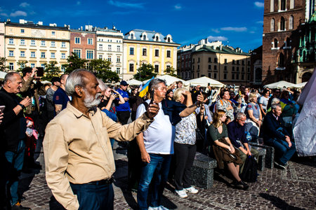 Krakow, Poland - October 08, 2022 Demonstration of Ukrainian people at Rynek GÅowny Square against the invasion of Russia, Poland hosts a large number of refugees due to the proximity of the countryのeditorial素材