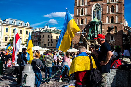 Krakow, Poland - October 08, 2022 Demonstration of Ukrainian people at Rynek GÅowny Square against the invasion of Russia, Poland hosts a large number of refugees due to the proximity of the countryのeditorial素材