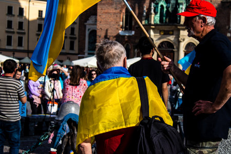 Krakow, Poland - October 08, 2022 Demonstration of Ukrainian people at Rynek GÅowny Square against the invasion of Russia, Poland hosts a large number of refugees due to the proximity of the countryのeditorial素材