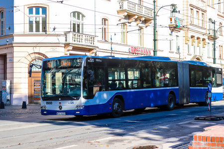 Krakow, Poland - October 08, 2022 Bus driving in the streets of Krakow and part of the transport system of the city, the fares are not expensiveのeditorial素材