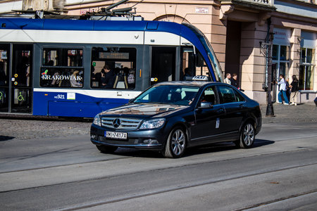 Krakow, Poland - October 08, 2022 Taxi driving in the streets of Krakow and part of the transport system of the city, several taxi companies compete for this activity and the fares are not expensiveのeditorial素材