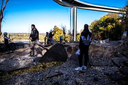 Aftermath of massive Russian missile attacks, a public garden near the Friendship Arch of Kyiv in the city center was hit hard. Missiles hit in 4 places in the city of Kyiv. 9 people died and 36 people were injured. Russia threatens more strikes after misのeditorial素材