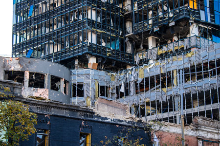 Aftermath of massive Russian missile attacks, an office building near the train station was hit hard. Missiles hit in 4 places in the city of Kyiv. 9 people died and 36 people were injured. Russia threatens more strikes after missiles hit cities across Ukのeditorial素材