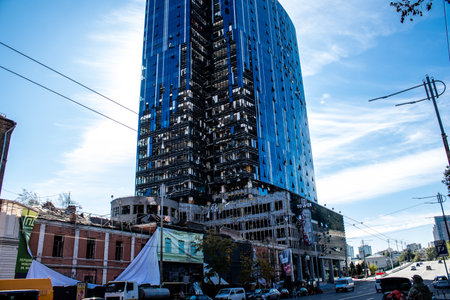 Aftermath of massive Russian missile attacks, an office building near the train station was hit hard. Missiles hit in 4 places in the city of Kyiv. 9 people died and 36 people were injured. Russia threatens more strikes after missiles hit cities across Ukのeditorial素材