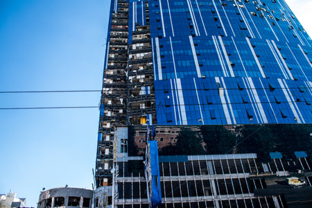 Aftermath of massive Russian missile attacks, an office building near the train station was hit hard. Missiles hit in 4 places in the city of Kyiv. 9 people died and 36 people were injured. Russia threatens more strikes after missiles hit cities across Ukのeditorial素材