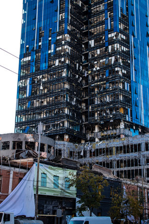Aftermath of massive Russian missile attacks, an office building near the train station was hit hard. Missiles hit in 4 places in the city of Kyiv. 9 people died and 36 people were injured. Russia threatens more strikes after missiles hit cities across Ukのeditorial素材