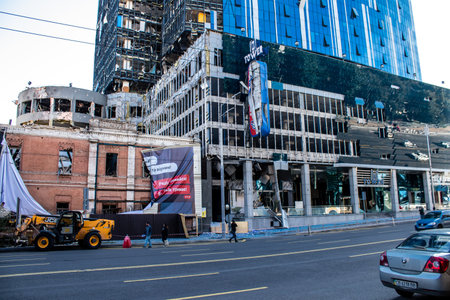 Aftermath of massive Russian missile attacks, an office building near the train station was hit hard. Missiles hit in 4 places in the city of Kyiv. 9 people died and 36 people were injured. Russia threatens more strikes after missiles hit cities across Ukのeditorial素材