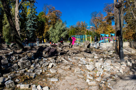 Aftermath of massive Russian missile attacks, a public garden in the city center was hit hard. Missiles hit in 4 places in the city of Kyiv. 9 people died and 36 people were injured. Russia threatens more strikes after missiles hit cities across Ukraineのeditorial素材
