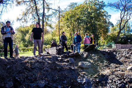 Aftermath of massive Russian missile attacks, a public garden in the city center was hit hard. Missiles hit in 4 places in the city of Kyiv. 9 people died and 36 people were injured. Russia threatens more strikes after missiles hit cities across Ukraineのeditorial素材