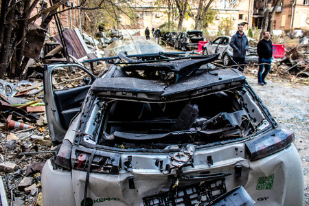 Aftermath of massive Russian missile attacks, cars around the Samsung office building was hit hard. The damage to the vehicles is considerable and several of them are destroyed.のeditorial素材