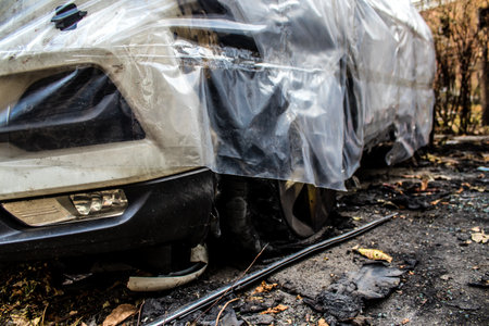 Aftermath of massive Russian missile attacks, cars around the Samsung office building was hit hard. The damage to the vehicles is considerable and several of them are destroyed.のeditorial素材