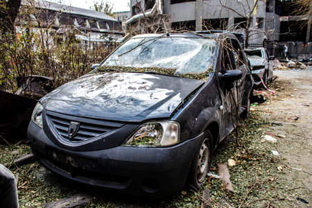 Aftermath of massive Russian missile attacks, cars around the Samsung office building was hit hard. The damage to the vehicles is considerable and several of them are destroyed.のeditorial素材