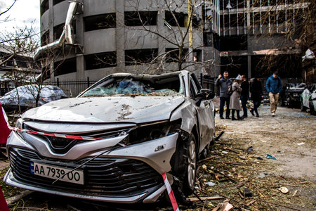 Aftermath of massive Russian missile attacks, cars around the Samsung office building was hit hard. The damage to the vehicles is considerable and several of them are destroyed.のeditorial素材
