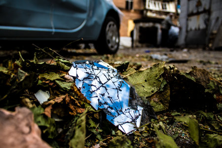 Aftermath of massive Russian missile attacks, debris littering the ground around the Samsung office building. The blast from the explosion sent shards of glass and metal in all directions causing extensive secondary damage, many people were seriously injuのeditorial素材