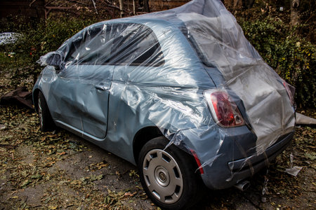 Aftermath of massive Russian missile attacks, cars around the Samsung office building was hit hard. The damage to the vehicles is considerable and several of them are destroyed.のeditorial素材