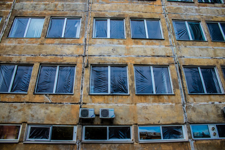 Aftermath of massive Russian missile attacks, debris littering the ground around the Samsung office building. The blast from the explosion sent shards of glass and metal in all directions causing extensive secondary damage, many people were seriously injuのeditorial素材