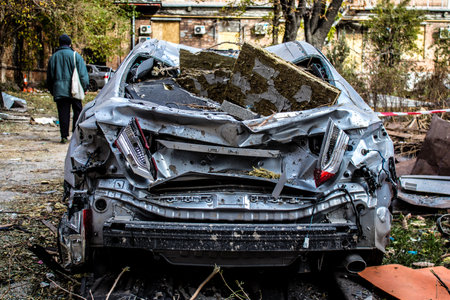 Aftermath of massive Russian missile attacks, cars around the Samsung office building was hit hard. The damage to the vehicles is considerable and several of them are destroyed.のeditorial素材