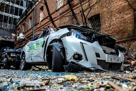 Aftermath of massive Russian missile attacks, cars around the Samsung office building was hit hard. The damage to the vehicles is considerable and several of them are destroyed.のeditorial素材