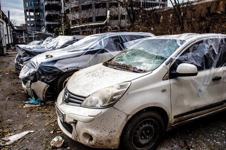Aftermath of massive Russian missile attacks, cars around the Samsung office building was hit hard. The damage to the vehicles is considerable and several of them are destroyed.のeditorial素材