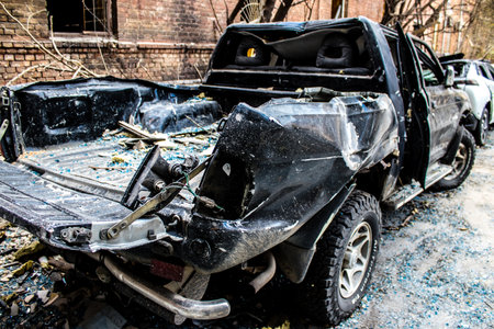Aftermath of massive Russian missile attacks, cars around the Samsung office building was hit hard. The damage to the vehicles is considerable and several of them are destroyed.のeditorial素材