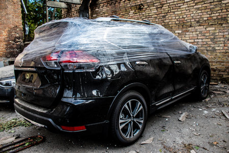 Aftermath of massive Russian missile attacks, cars around the Samsung office building was hit hard. The damage to the vehicles is considerable and several of them are destroyed.のeditorial素材