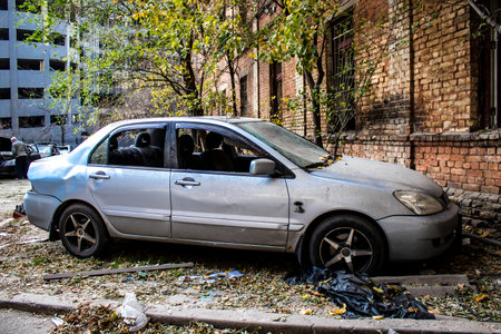 Aftermath of massive Russian missile attacks, cars around the Samsung office building was hit hard. The damage to the vehicles is considerable and several of them are destroyed.のeditorial素材