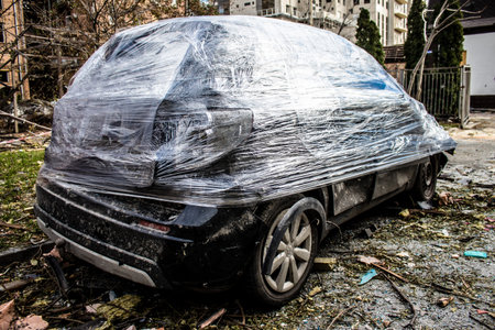 Aftermath of massive Russian missile attacks, cars around the Samsung office building was hit hard. The damage to the vehicles is considerable and several of them are destroyed.のeditorial素材