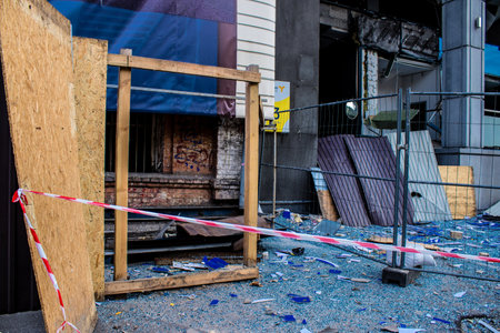 Aftermath of massive Russian missile attacks, debris littering the ground around the Samsung office building. The blast from the explosion sent shards of glass and metal in all directions causing extensive secondary damage, many people were seriously injuのeditorial素材